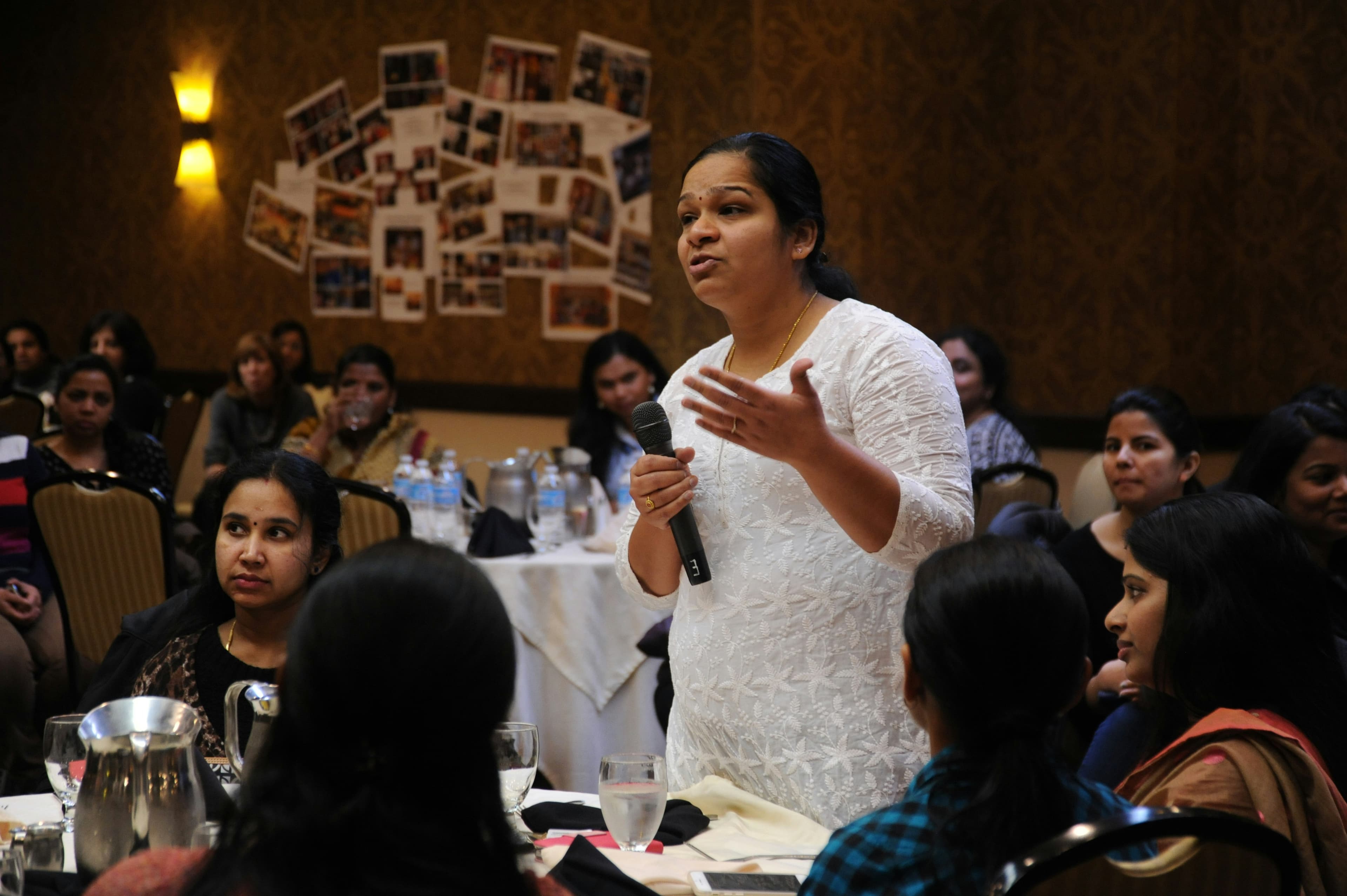 woman speaking up at a public event
